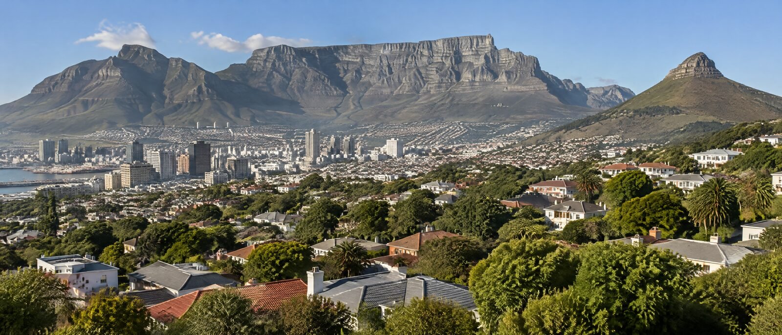 Table Mountain seen across the city bowl in clear afternoon light, suburbs in the foreground